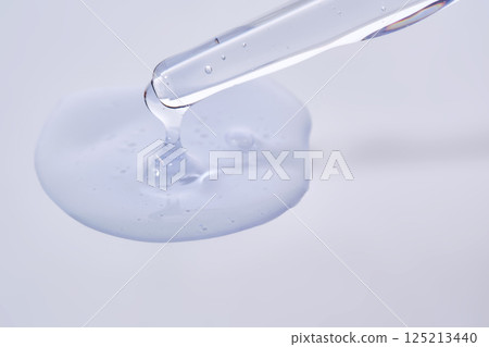 Pipette with delicate blue serum close-up. Pipette with delicate blue serum close-up. 125213440