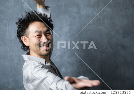 A bearded man dancing A bearded man dancing 125213535