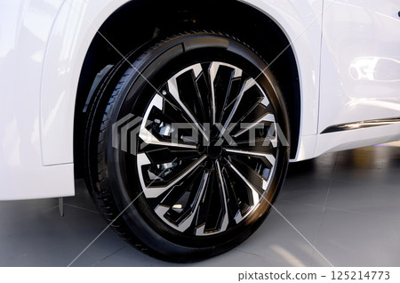 Car wheel with brake calipers and stylish design. 125214773