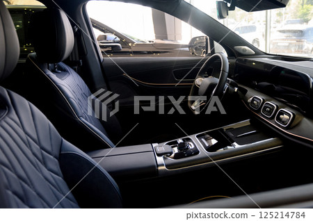 Close up of modern new car interior with black leather seats Close up of modern new car interior with black leather seats 125214784