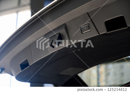Electric car trunk lock button with trunk closing handle. Rear trunk lock. Electric car trunk lock button with trunk closing handle. Rear trunk lock. 125214812