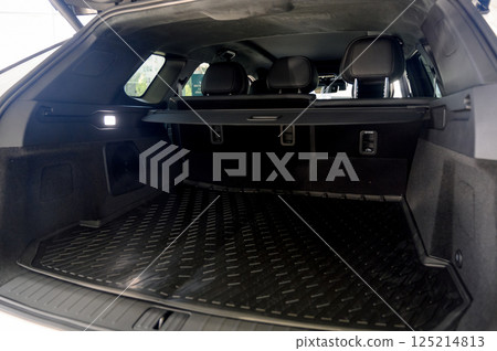 Large black empty car trunk. Open car trunk close up Large black empty car trunk. Open car trunk close up 125214813