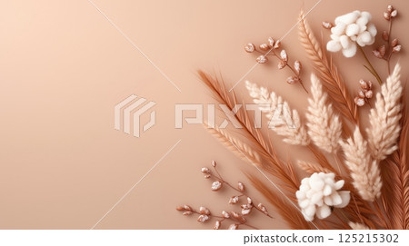 Minimalist arrangement of dried flowers on a beige background 125215302