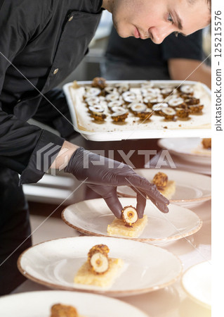 Chef preparing tasty starters Chef preparing tasty starters 125215576