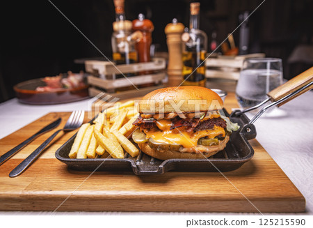 Tasty hamburger with melted cheese 125215590
