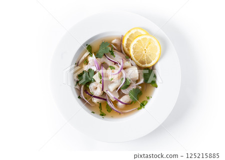Traditional Peruvian ceviche sea bass fillet isolated on white background. 125215885