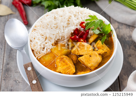 Massaman curry isolated on white background. Traditional Thai food recipe 125215949