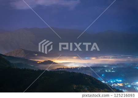 Mystical Spring Night: Mist and Lights in Yuchi's Mountain Forest. 125216093