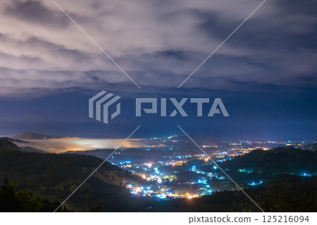 Mystical Spring Night: Mist and Lights in Yuchi's Mountain Forest. 125216094