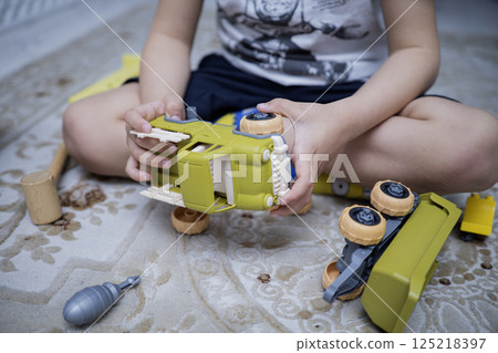 Child with autism playing with cars. Autism concept Child with autism playing with cars. Autism concept 125218397