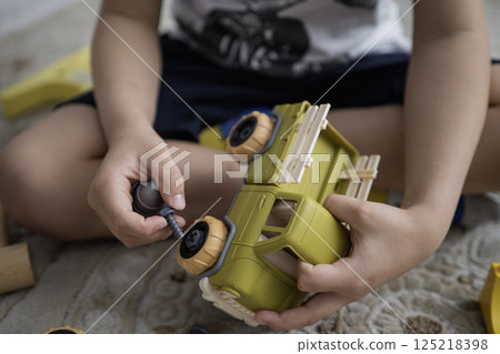 Child with autism playing with cars. Autism concept Child with autism playing with cars. Autism concept 125218398