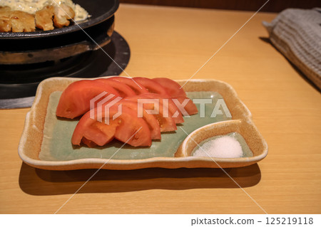 Traditional Japanese Meal with Rice, Sliced Tomatoes 125219118