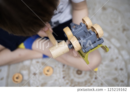 Child with autism playing with cars. Autism concept Child with autism playing with cars. Autism concept 125219162