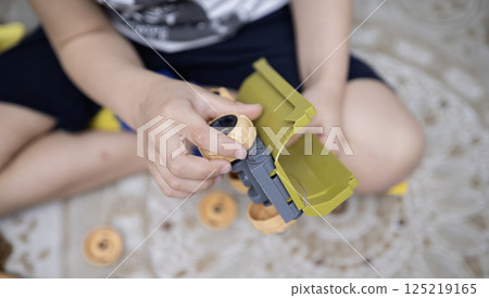 Child with autism playing with cars. Autism concept Child with autism playing with cars. Autism concept 125219165