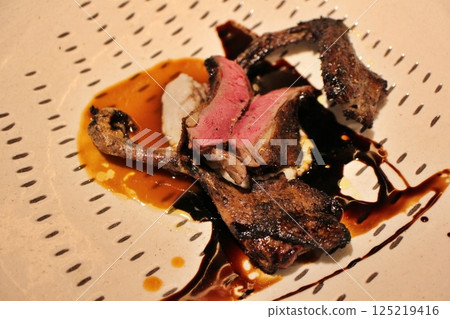 Italian cuisine: Roasted smoked pigeon Italian cuisine: Roasted smoked pigeon 125219416