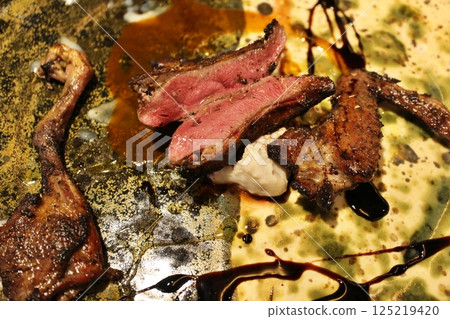 Italian cuisine: Roasted smoked pigeon 125219420
