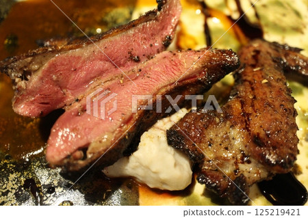 Italian cuisine: Roasted smoked pigeon 125219421