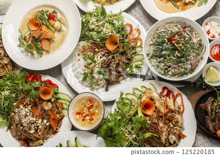 assortment of mixed traditional vietnamese food dishes on buffet table 125220185
