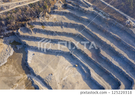 Open pit granite quarry, view from above 125220318