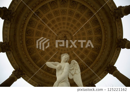 Cupid statue in the Hall of Love at the Petit Trianon in the Palace of Versailles, a UNESCO World Heritage Site Cupid statue in the Hall of Love at the Petit Trianon in the Palace of Versailles, a UNESCO World Heritage Site 125221162