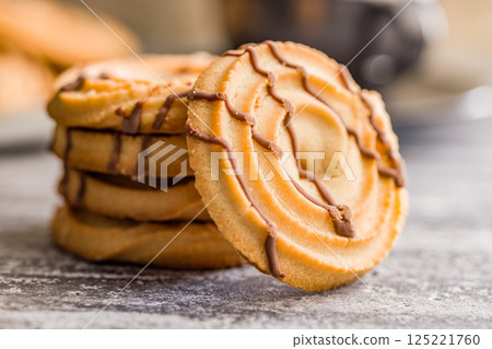 Sweet chocolate cookies on kitchen table. 125221760
