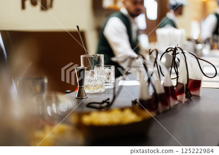 Crafting unique cocktails with fresh ingredients at a local bar counter Crafting unique cocktails with fresh ingredients at a local bar counter 125222984