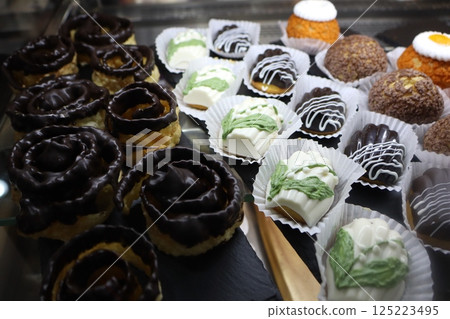 A Delicious Assortment of Exquisite Gourmet Cakes and Assorted Pastries Await You 125223495