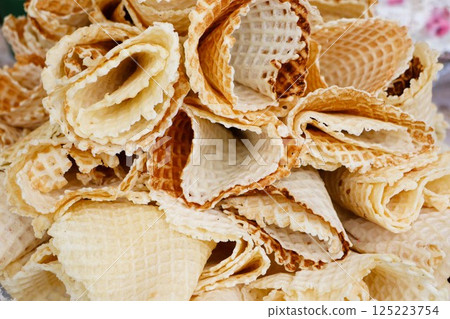 A Delicious Assortment of Lacy Ice Cream Cone Waffle Cups Perfect for Any Occasion 125223754