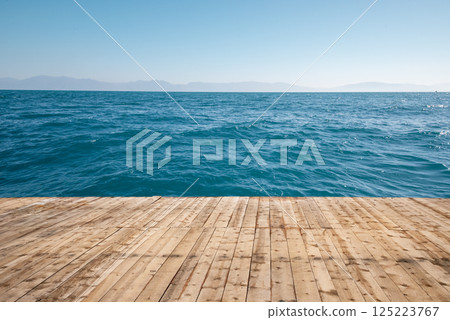 Wooden flloor on pier with blue sea. Wooden flloor on pier with blue sea. 125223767