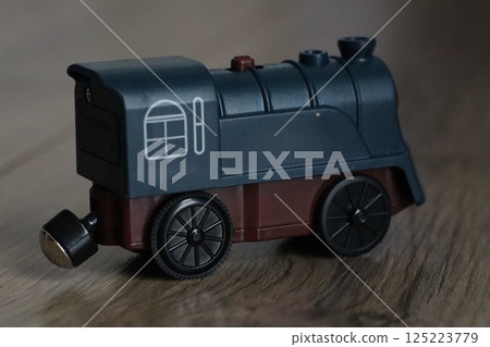 This is a Vintage Toy Train Engine crafted in elegant Dark Blue and Brown Colors, perfect for play 125223779