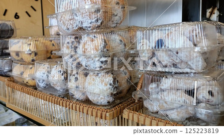 A Variety of Assorted Packaged Cookies beautifully Displayed in a Cozy Cafe Bakery 125223819