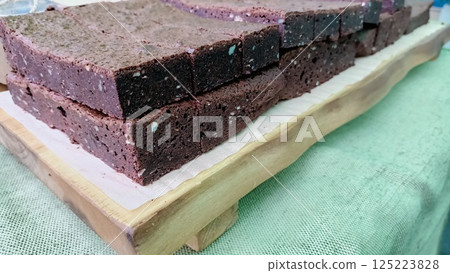 Indulgently Delicious Brownie Squares Beautifully Placed on a Rustic Wooden Serving Board 125223828