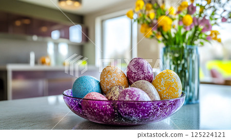 Bright Easter eggs on a purple dish on a table near a vase with a bouquet of yellow spring flowers. Celebrating holidays in April. Festive home decor. This is AI-generated item Bright Easter eggs on a purple dish on a table near a vase with a bouquet of yellow spring flowers. Celebrating holidays in April. Festive home decor. This is AI-generated item 125224121