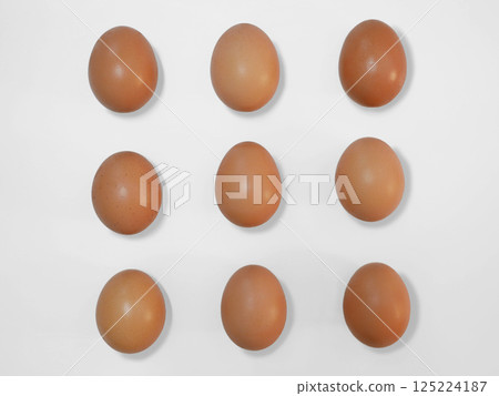 Raw brown chicken eggs on a white background with copy space 125224187