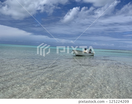Blue sea and boat Blue sea and boat 125224209