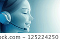 Smiling customer support agent with headset providing quality assistance 125224250