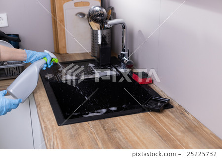 Cleaning the Kitchen Sink: A Step-by-Step Guide to Maintaining Hygiene in Your Home Environment with Effective Cleaning Solutions and Proper Tools 125225732