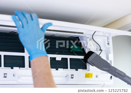 Professional Cleaning of Air Conditioning Unit: Maintenance Importance for Indoor Air Quality and Environmental Health Compliance Standards Professional Cleaning of Air Conditioning Unit: Maintenance Importance for Indoor Air Quality and Environmental Health Compliance Standards 125225782