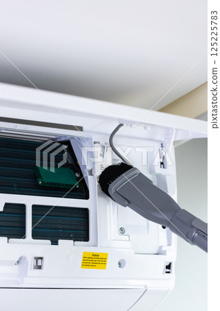 Cleaning and Maintenance of an Air Conditioning Unit: How to Properly Maintain Your AC System for Optimal Performance and Longevity 125225783