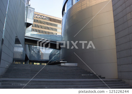 Modern architectural space with glass and concrete structures 125226244