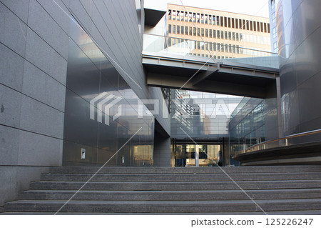 Modern architectural space with glass and concrete structures Modern architectural space with glass and concrete structures 125226247