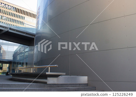 Modern architectural space with glass and concrete structures Modern architectural space with glass and concrete structures 125226249