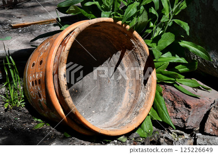 Small broken Clay pots along roadside 125226649
