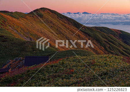 Mount Tainai and the Asahi mountain range at sunrise as seen from Mount Monnai in the Iide mountain range 125226823
