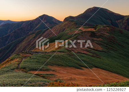 Mount Kitamata and Mount Baikabi seen at dawn from Mount Monnai in the Iide mountain range Mount Kitamata and Mount Baikabi seen at dawn from Mount Monnai in the Iide mountain range 125226927