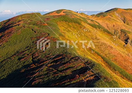 Morning view of Mt. Monnai and Monnai hut from the climb up Mt. Kitamata 125228093