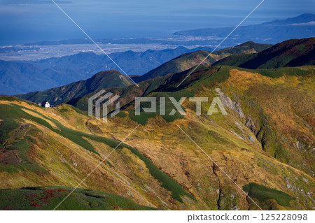 View of Mt. Monnai and Mt. Iwasedake from Mt. Kitamata in the Iide mountain range and the Sea of Japan near Murakami 125228098