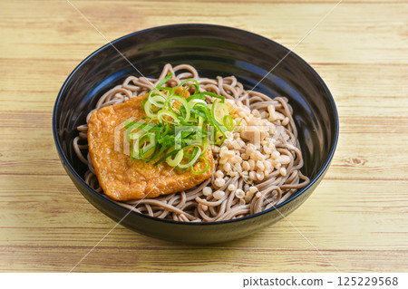 Cold soba noodles with fried tofu and tempura flakes Cold soba noodles with fried tofu and tempura flakes 125229568