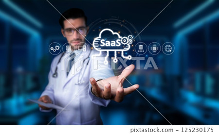 Doctor presenting cloud technology concept with SaaS platform and digital icons in a modern medical office environment for healthcare innovation. PHMT 125230175