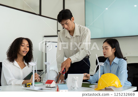 ESG Strategies and Team Dynamics. Professionals engaged in an eco-friendly project discussion. ESG Strategies and Team Dynamics. Professionals engaged in an eco-friendly project discussion. 125232669